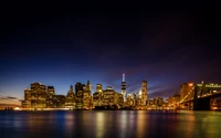 Explora el impresionante horizonte nocturno de la ciudad de Nueva York