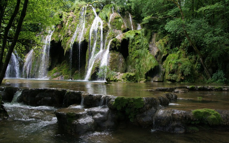 Breathtaking Waterfall in a Lush Green Setting