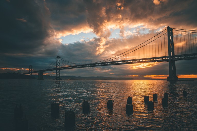 Explore the Breathtaking Sunset Wallpaper of the Golden Gate Bridge