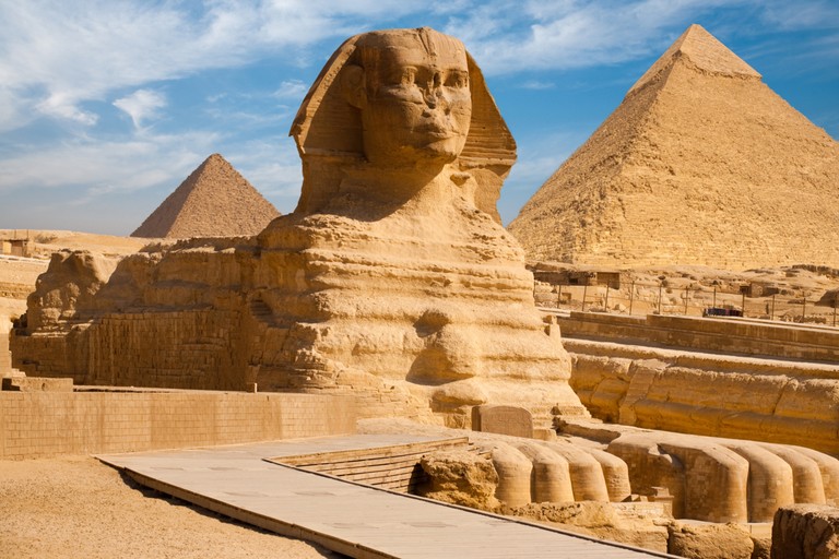 Explore the Majestic Great Sphinx and Pyramids Wallpaper