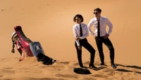 Download Men in Black International Wallpaper Featuring Tessa Thompson and Chris Hemsworth