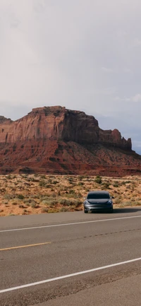 Descargar Impresionante Fondo de Pantalla Tesla Model 3 con Monument Valley