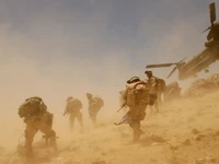 Epic Military Scene: Troops Maneuvering in Dusty Terrain