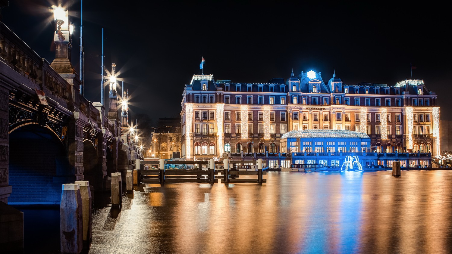 Explore the Illuminated Night Scene of Amsterdam