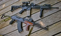 Stunning Rifle Wallpaper Featuring M4 Carbine and AK-47