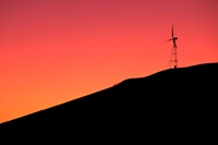 Éblouissante Silhouette de Moulin à Vent au Lever du Soleil