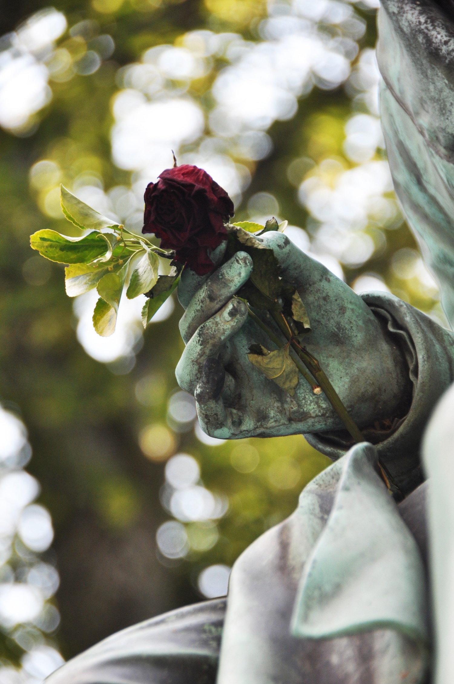 Stunning Sculpture Featuring a Hand and Rose