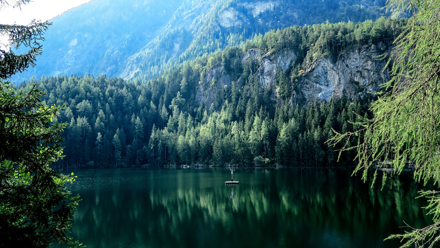 Beautiful Wilderness Wallpaper Featuring a Reflective Lake