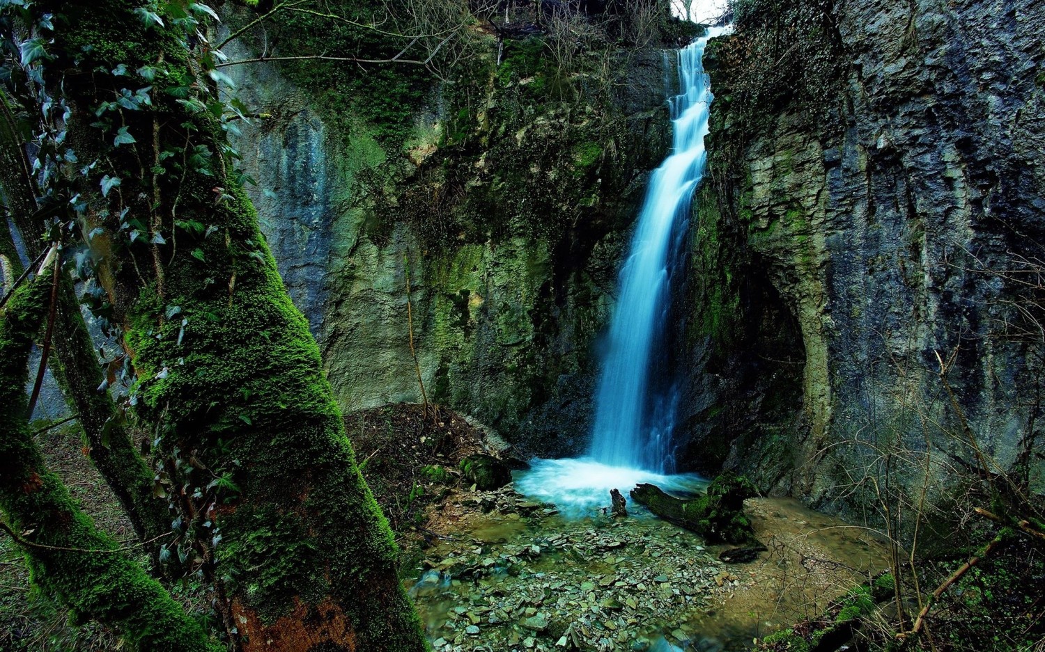 Explore the Serenity of Nature with This Waterfall Wallpaper