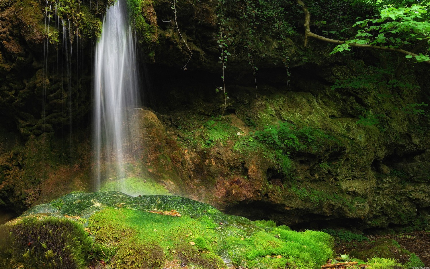 Explore the Tranquility of Nature with Our Waterfall Wallpaper