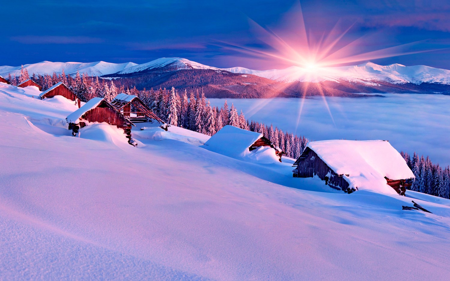 Breathtaking Winter Wallpaper: Snow-Covered Mountains at Dawn