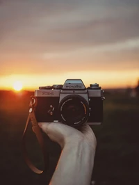 Téléchargez le fond d'écran parfait de la caméra Minolta au coucher de soleil