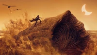 Fondo de pantalla de Dune Parte 2: Paul Atreides montando un Sandworm