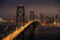 Explora la Impresionante Iluminación Nocturna del Puente de la Bahía de San Francisco