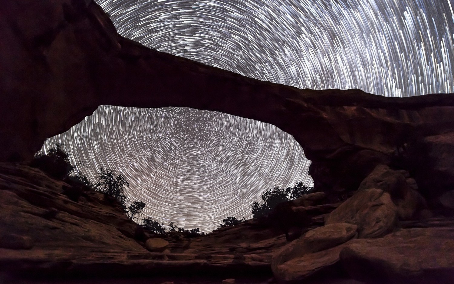 Breathtaking Night Sky Above Natural Arch in Canyonlands National Park