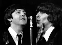 The Beatles: Iconic Black and White Performance Wallpaper