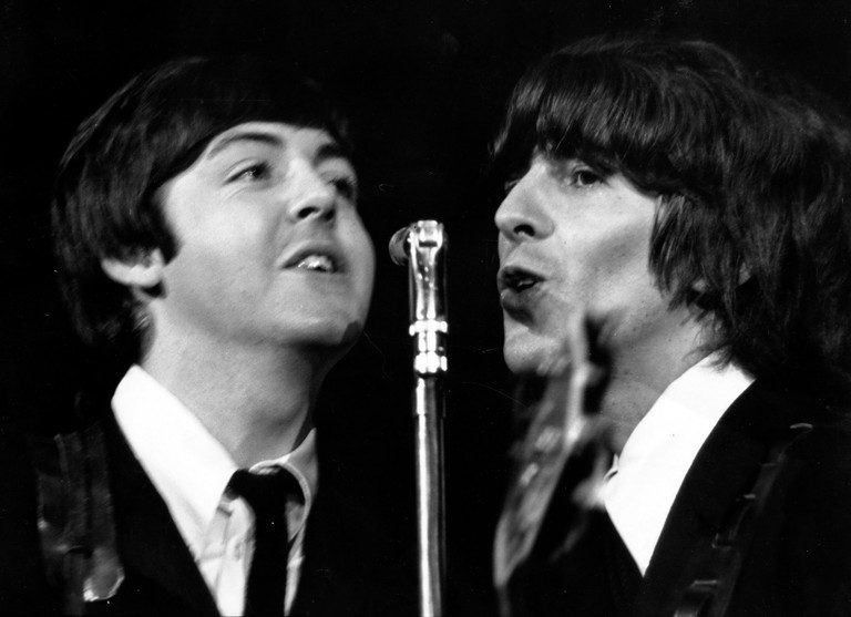 The Beatles: Iconic Black and White Performance Wallpaper