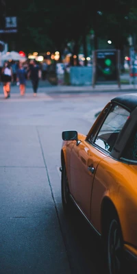 Explora nuestro hermoso fondo de pantalla de un coche naranja