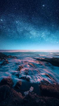 Download the Breathtaking Ocean and Starry Sky Wallpaper