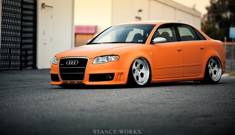 Audi RS4: Eye-Catching Orange Sedan Wallpaper