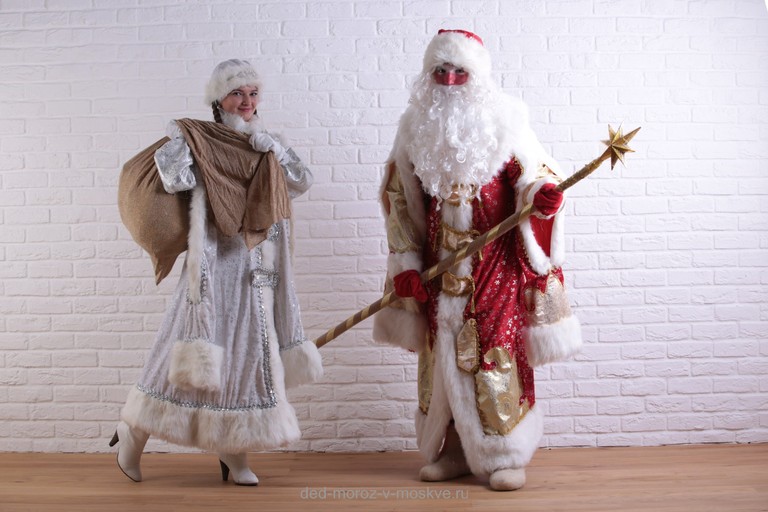 Celebrate the Season with Santa Claus and Ded Moroz Wallpaper