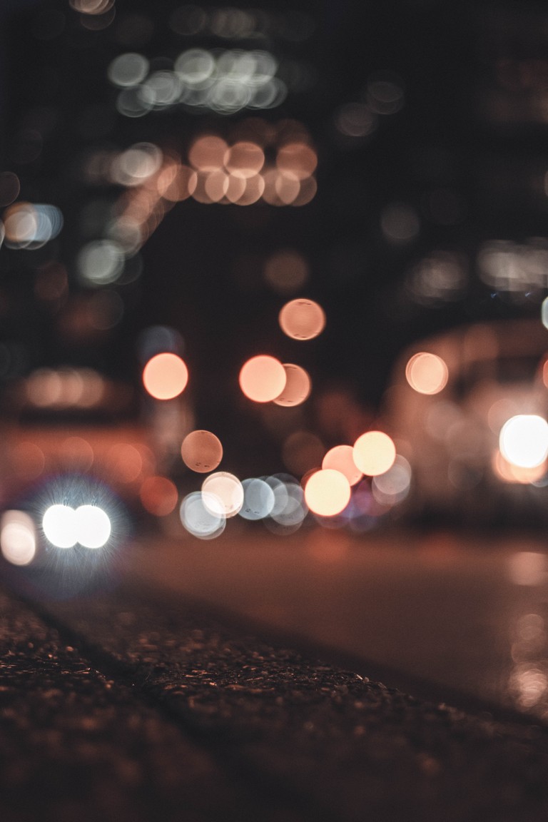 Download Our Nighttime Cityscape Wallpaper Featuring Bokeh Lights