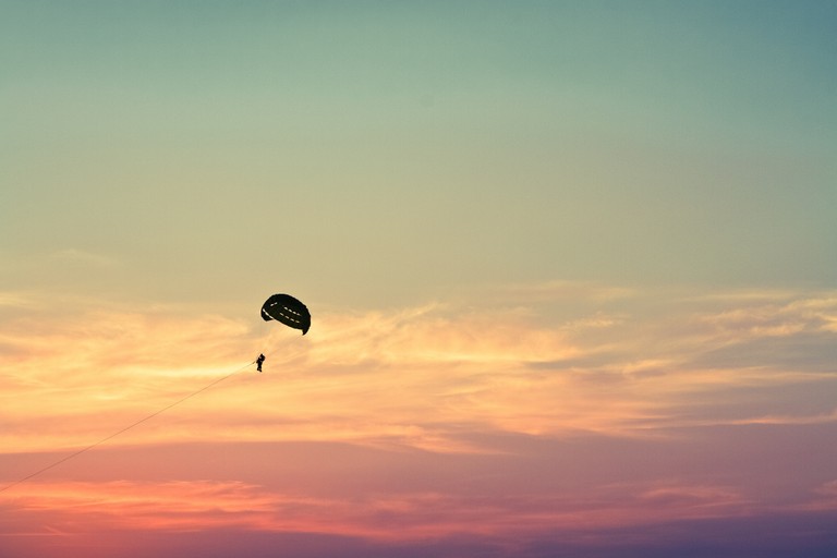 Explore the Thrill of Parasailing with Our Stunning Wallpaper