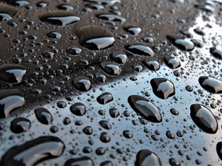 Water Droplets on Metal Surface Wallpaper