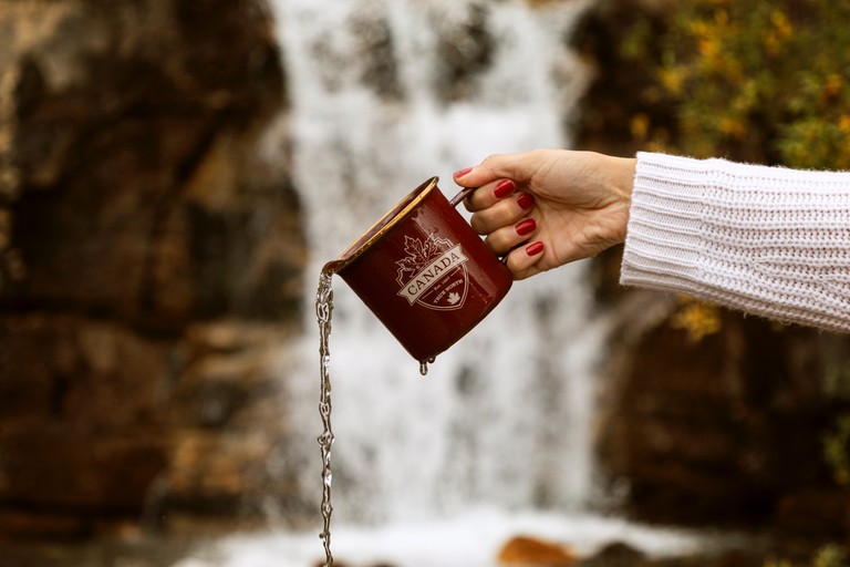 Beautiful Waterfall Scene with Mug