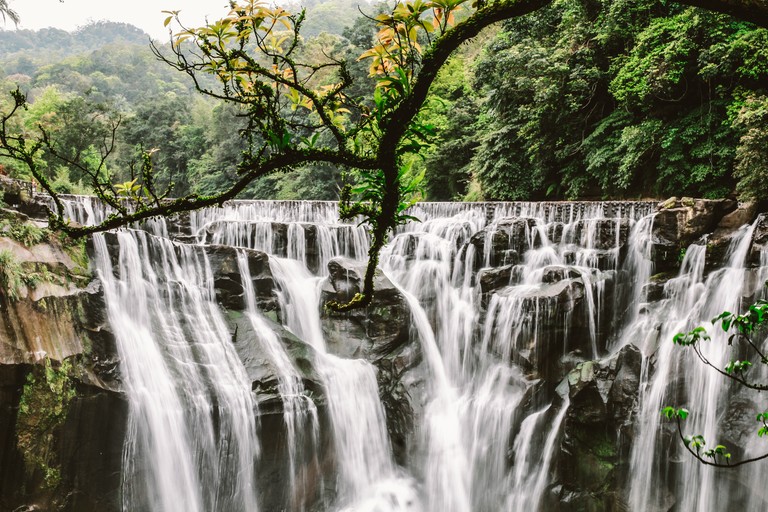 Explore the Majestic Waterfall Wallpaper