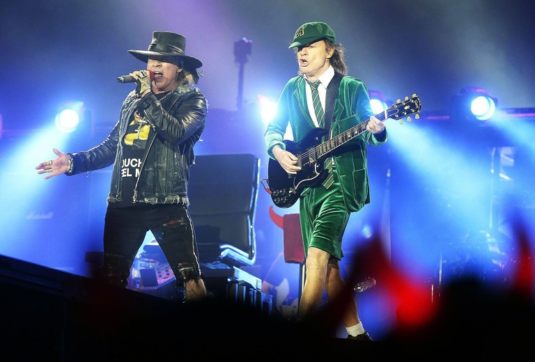 Download Stunning Wallpaper of Axl Rose and AC/DC's Angus Young in Concert