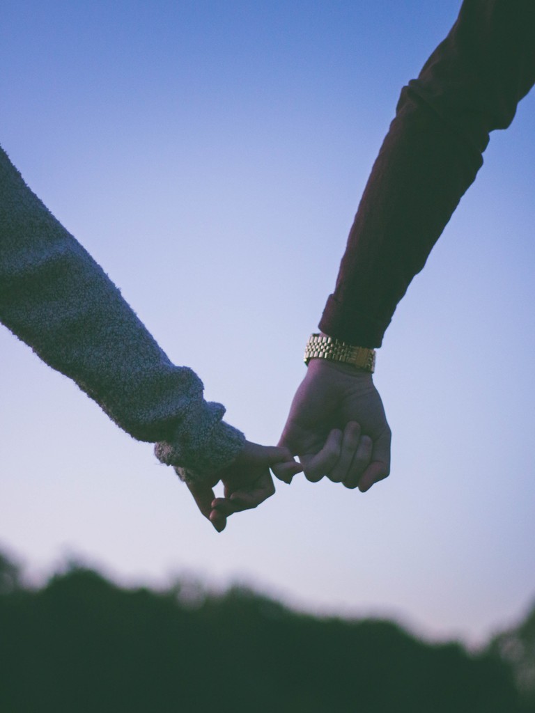 Download Our Stunning Holding Hands Wallpaper