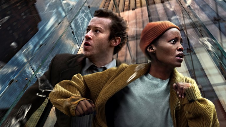 A Quiet Place Day One Wallpaper Featuring Joseph Quinn and Lupita Nyong'o