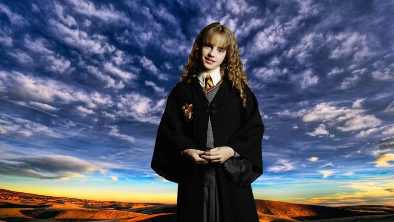 Enchanting Hogwarts Sky Wallpaper featuring a Mysterious Girl