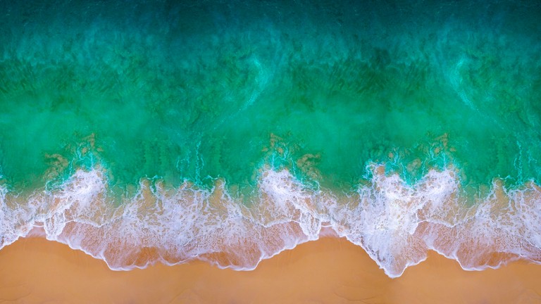 Download Stunning Aerial View of Beach Waves Wallpaper