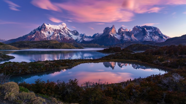 Explore the Torres del Paine: A Majestic Mountain and Lake Wallpaper