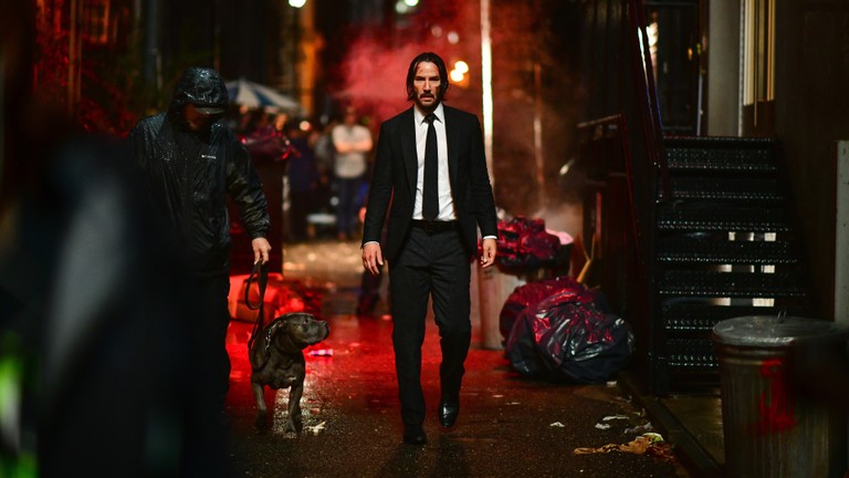 John Wick 3 Wallpaper Featuring Keanu Reeves and His Loyal Dog