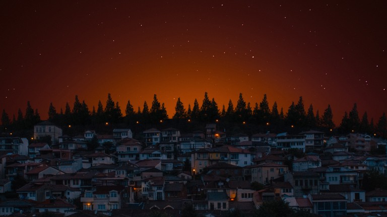 Beautiful Night Scene with Houses and Stars